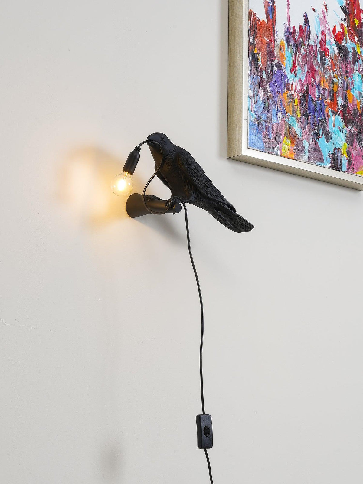 Tirixel Kunstharz-Wandleuchte in Kieselsteinform