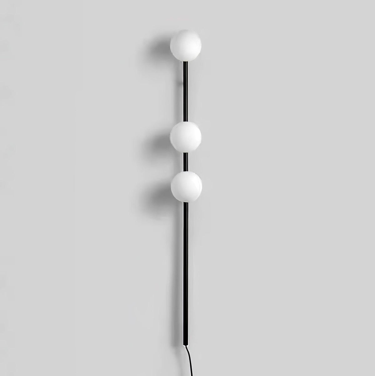 Ultheia zeitgenössische minimalistische Wandleuchte aus Glas in Kieselsteinform