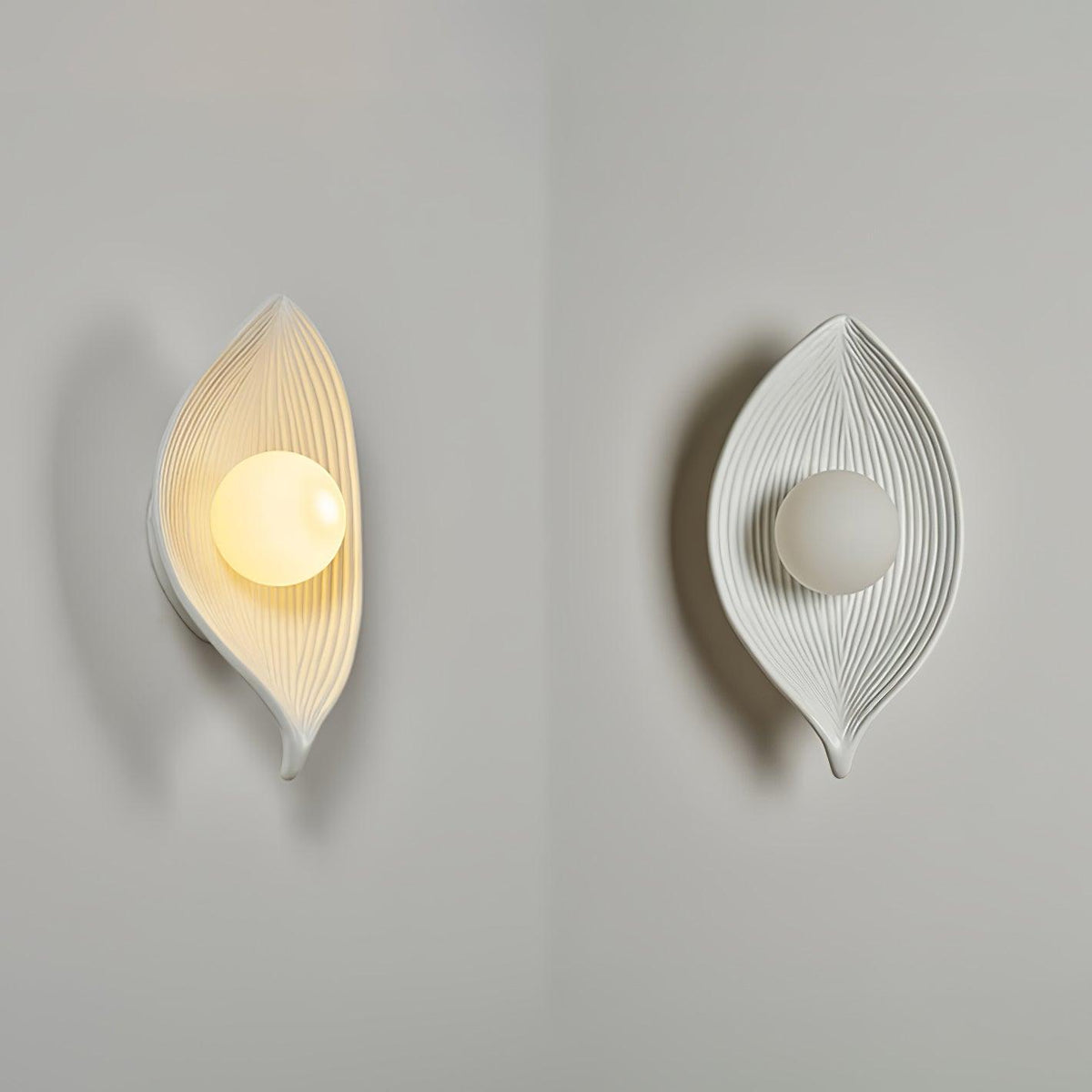 Lirixa Wandleuchte aus Kunstharz in Kieselsteinform