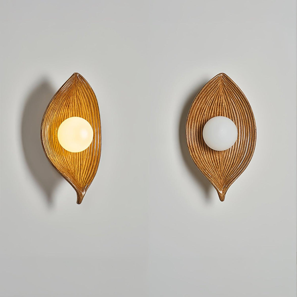Lirixa Wandleuchte aus Kunstharz in Kieselsteinform